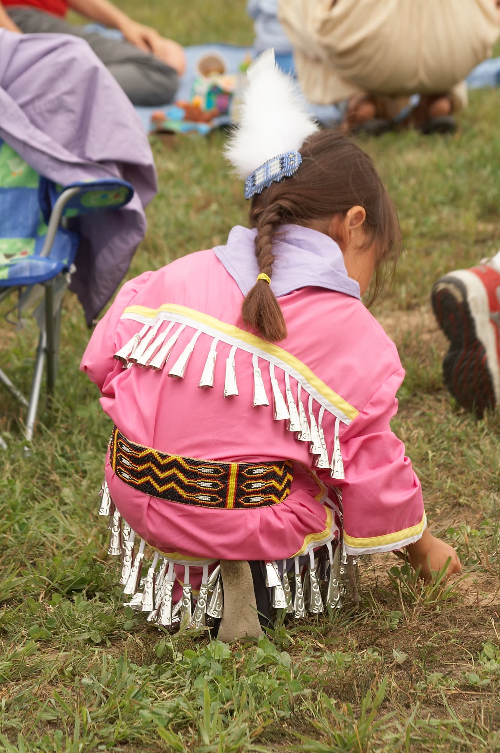 Young girl in traditional pink attire at an Alderville Pow Wow.