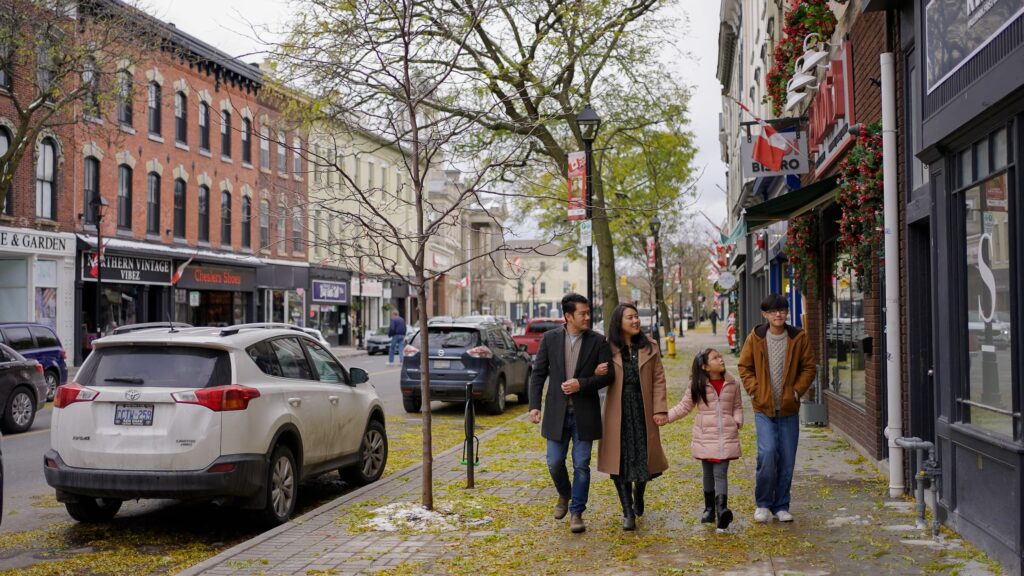 Family of four walking downtown in the spring.