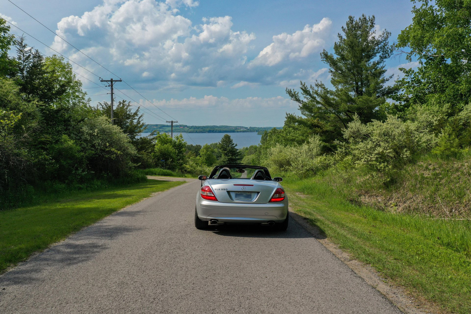 Car driving towards Rice Lake