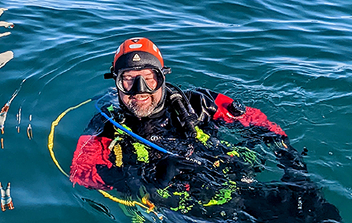 Dive The North - Photo of a scuba diver in the water.