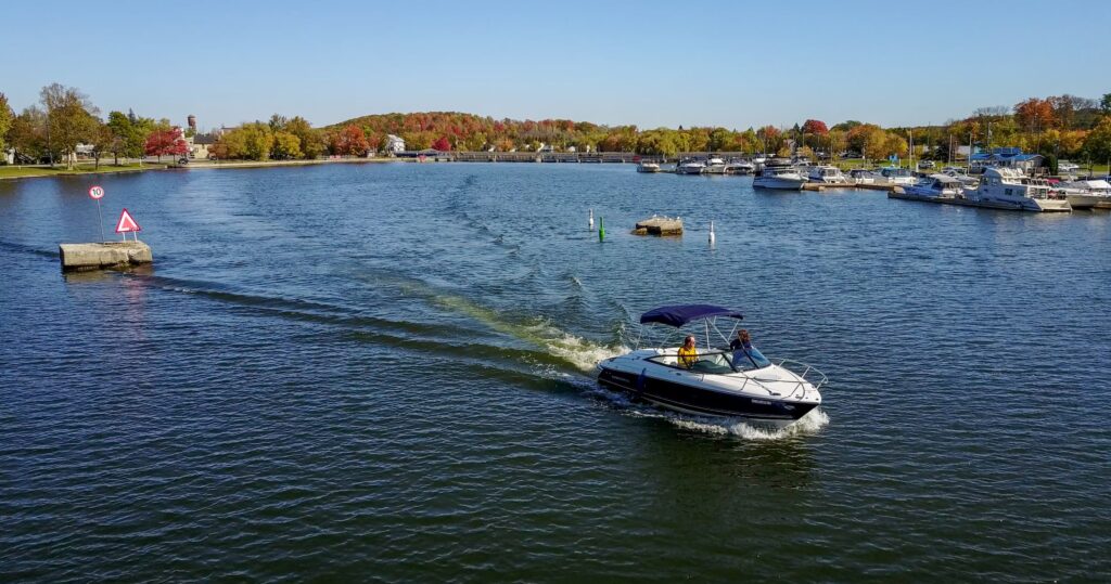 drone view of speedboat near Hastings Marina in fall.