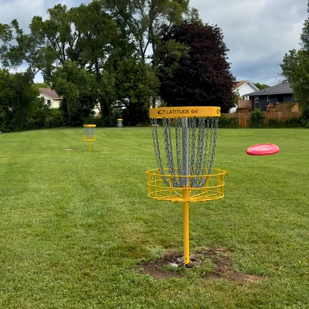 Yellow disc golf basket at Brighton Disc Golf Park