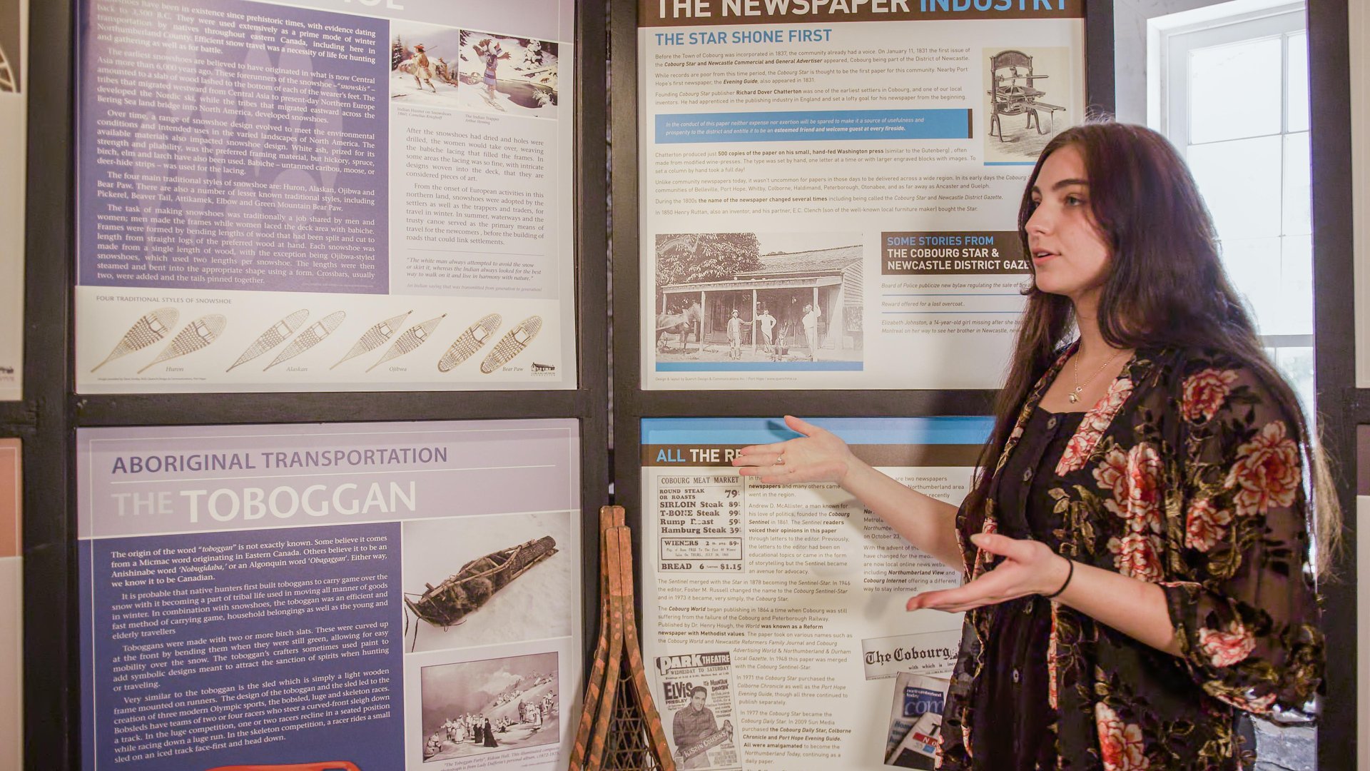 Woman sharing information about displays at a museum