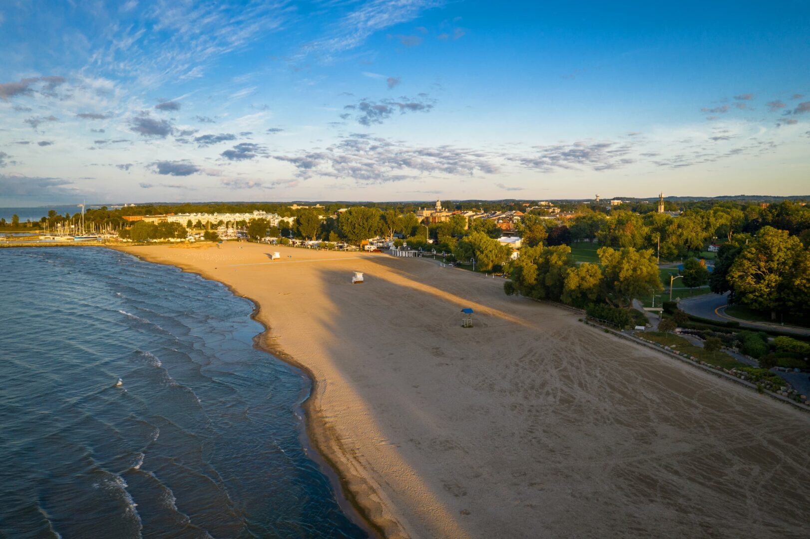 Drone view of Cobourg Beach at sunset