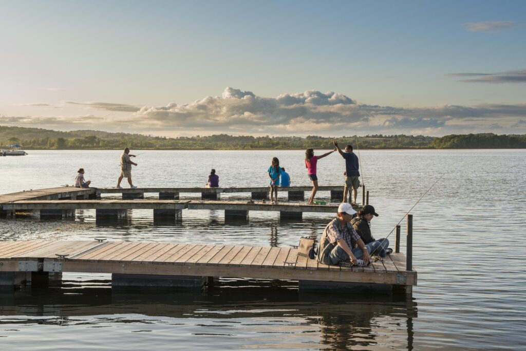 People lined up on public docks fishing