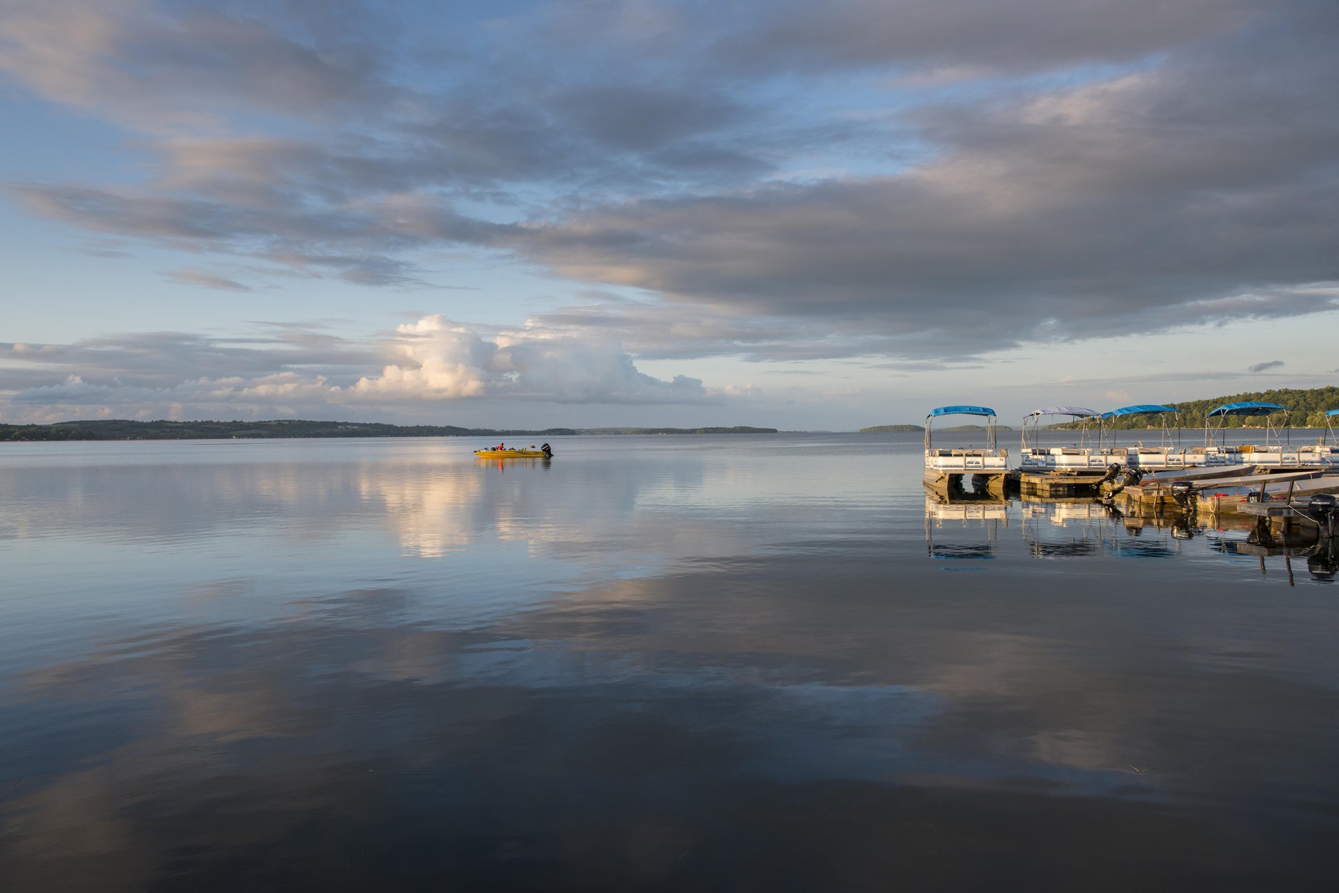 Boat on the lake near a marina