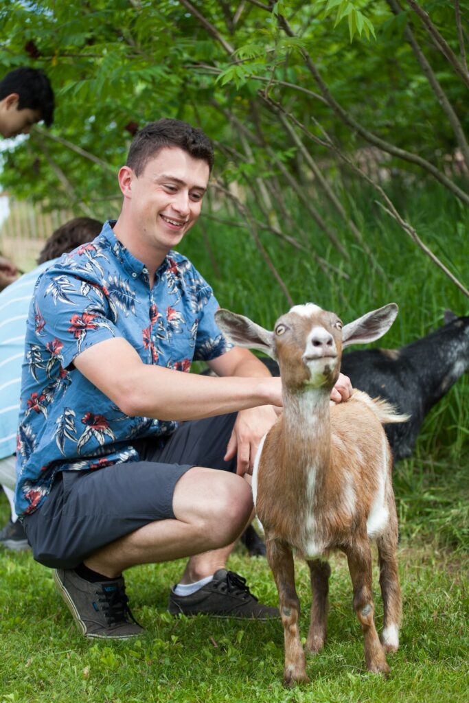 Man petting a goat