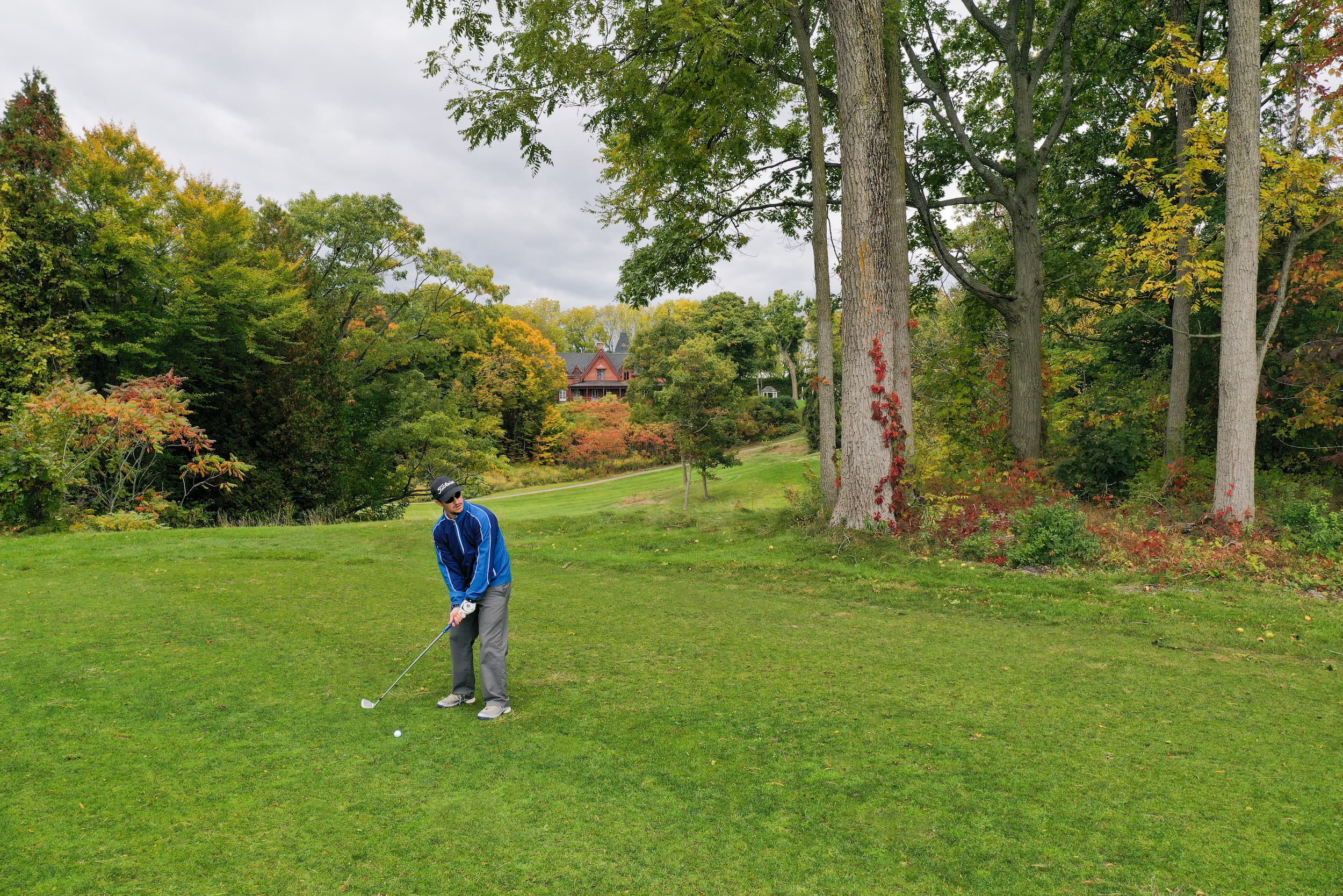 Man golfing in the fall