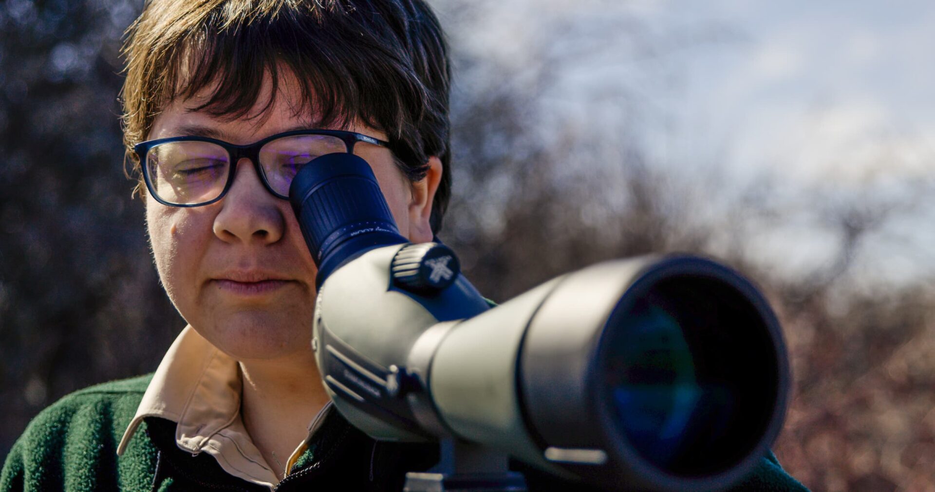 Woman birding with a scope