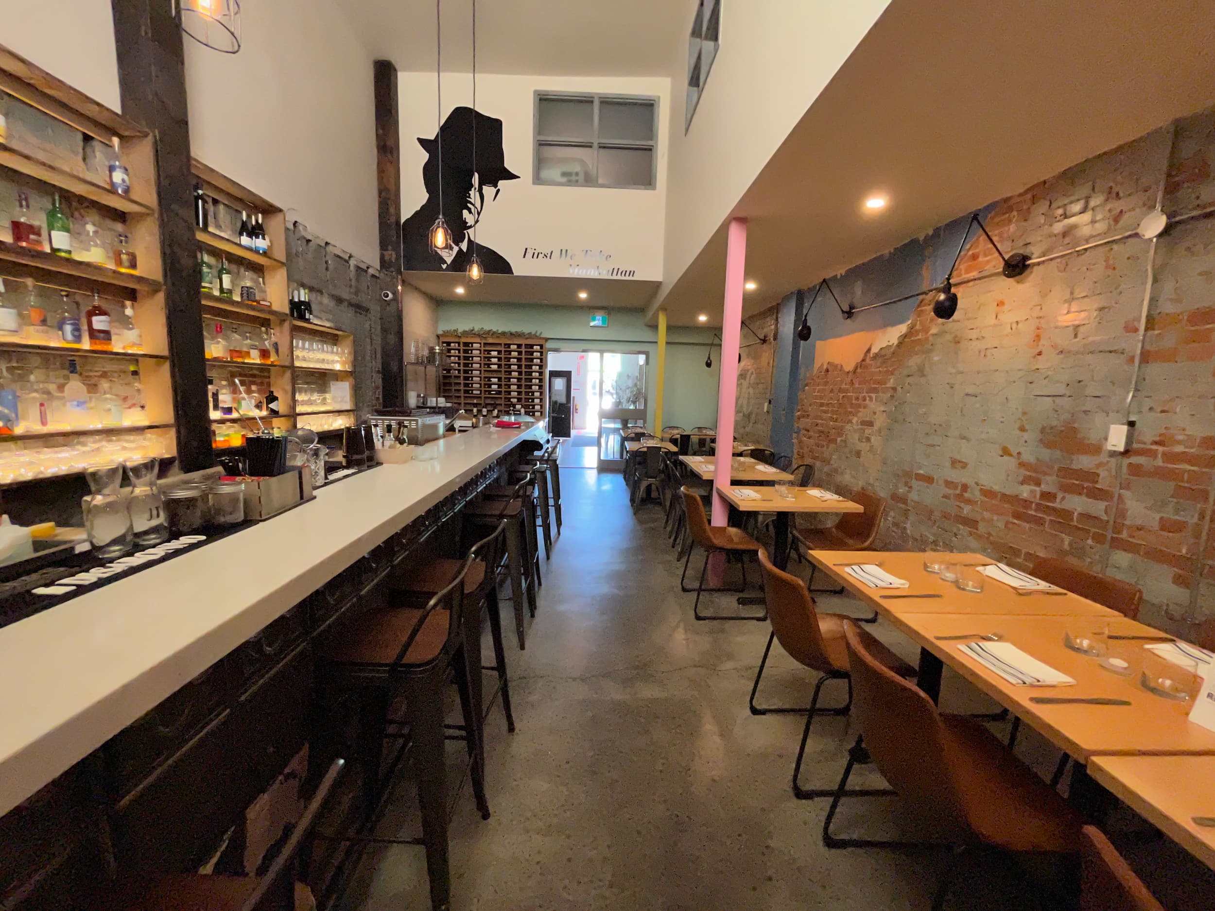 Interior of Twenty Six Restaurant with tables and bar