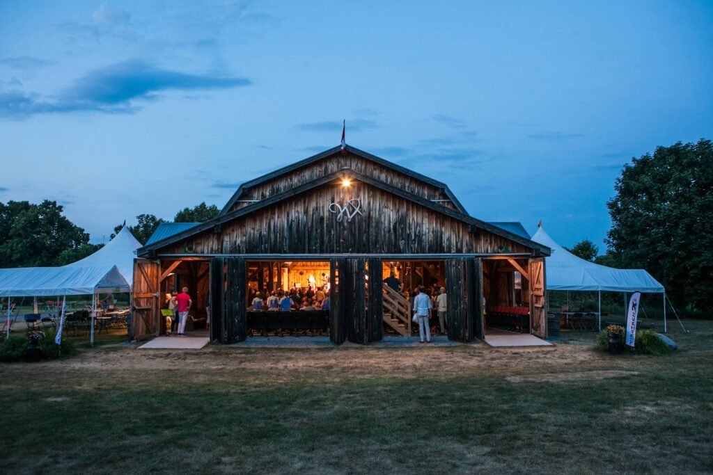 Exterior of Westben performance barn at dusk