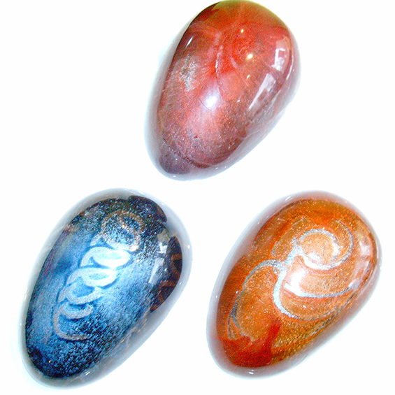 3 metalic coloured oval truffles.