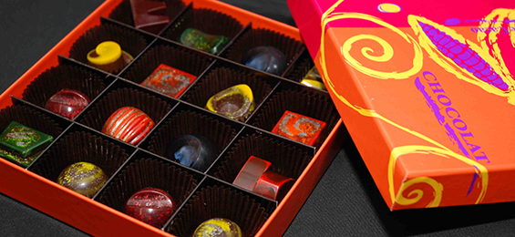 Orange, pink and yellow box of assorted truffles
