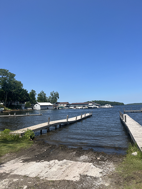 Boat launch with long docks on either side.