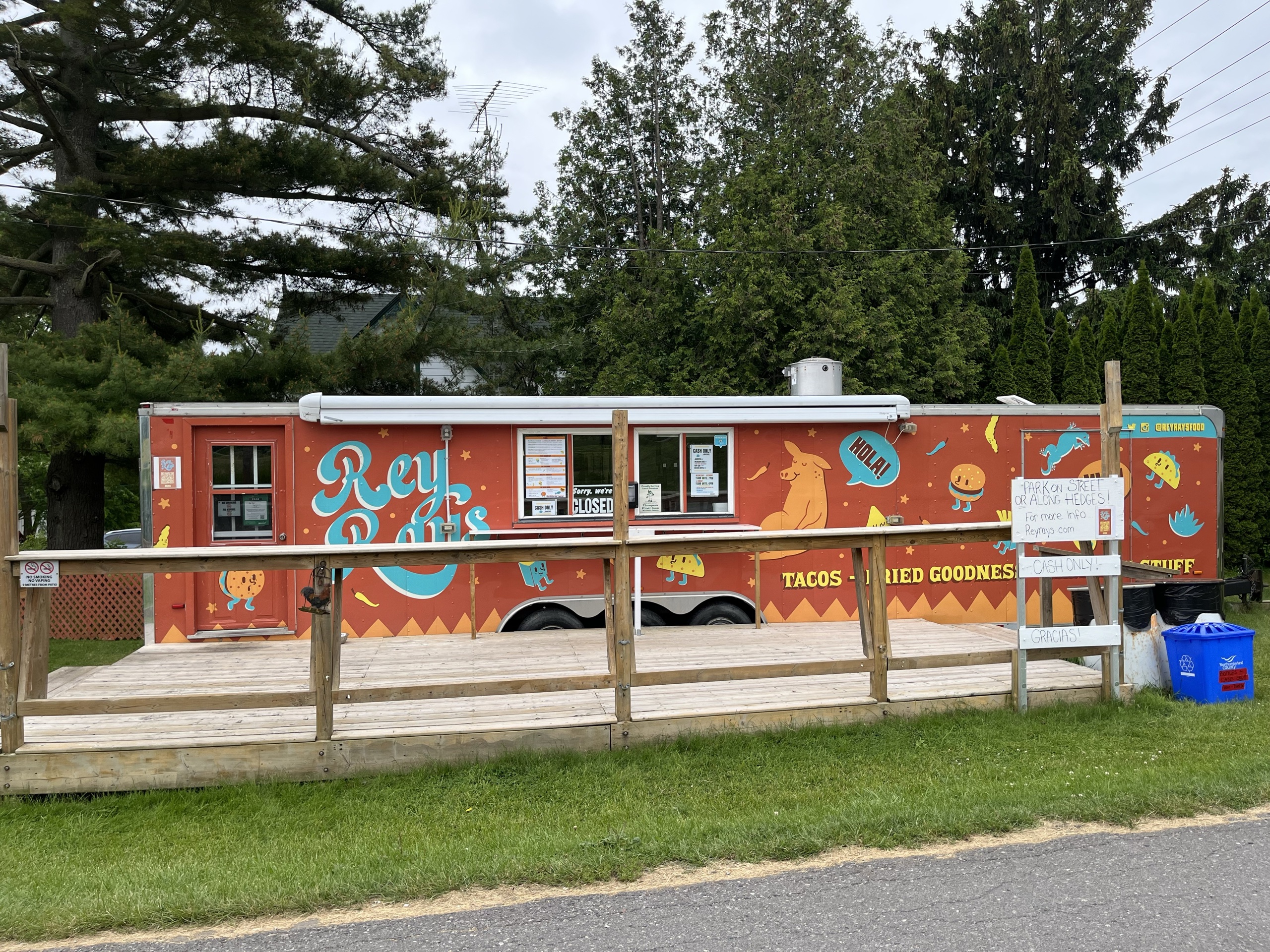 Photo of Rey Ray's food truck. Food truck features order window in the middle of the food truck.