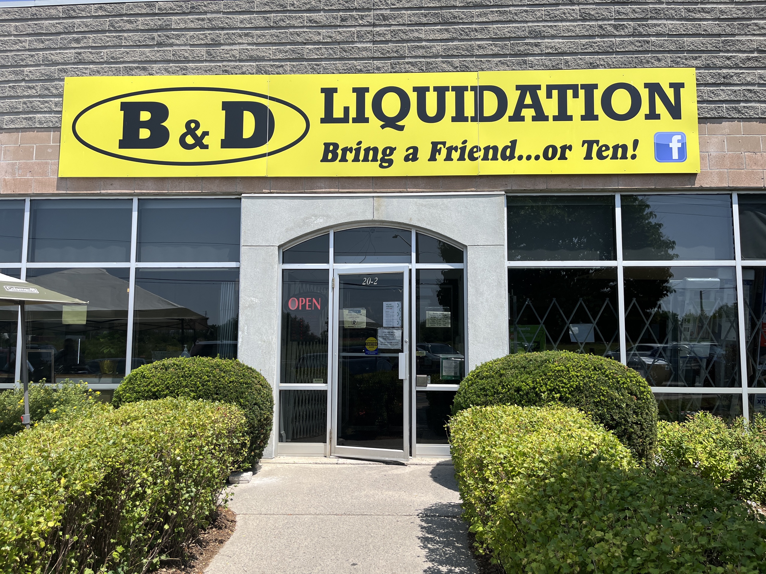 Photo of B&D Liquidation storefront. Sign above door reads "B&D Liquidation. Bring a friend... or ten!"