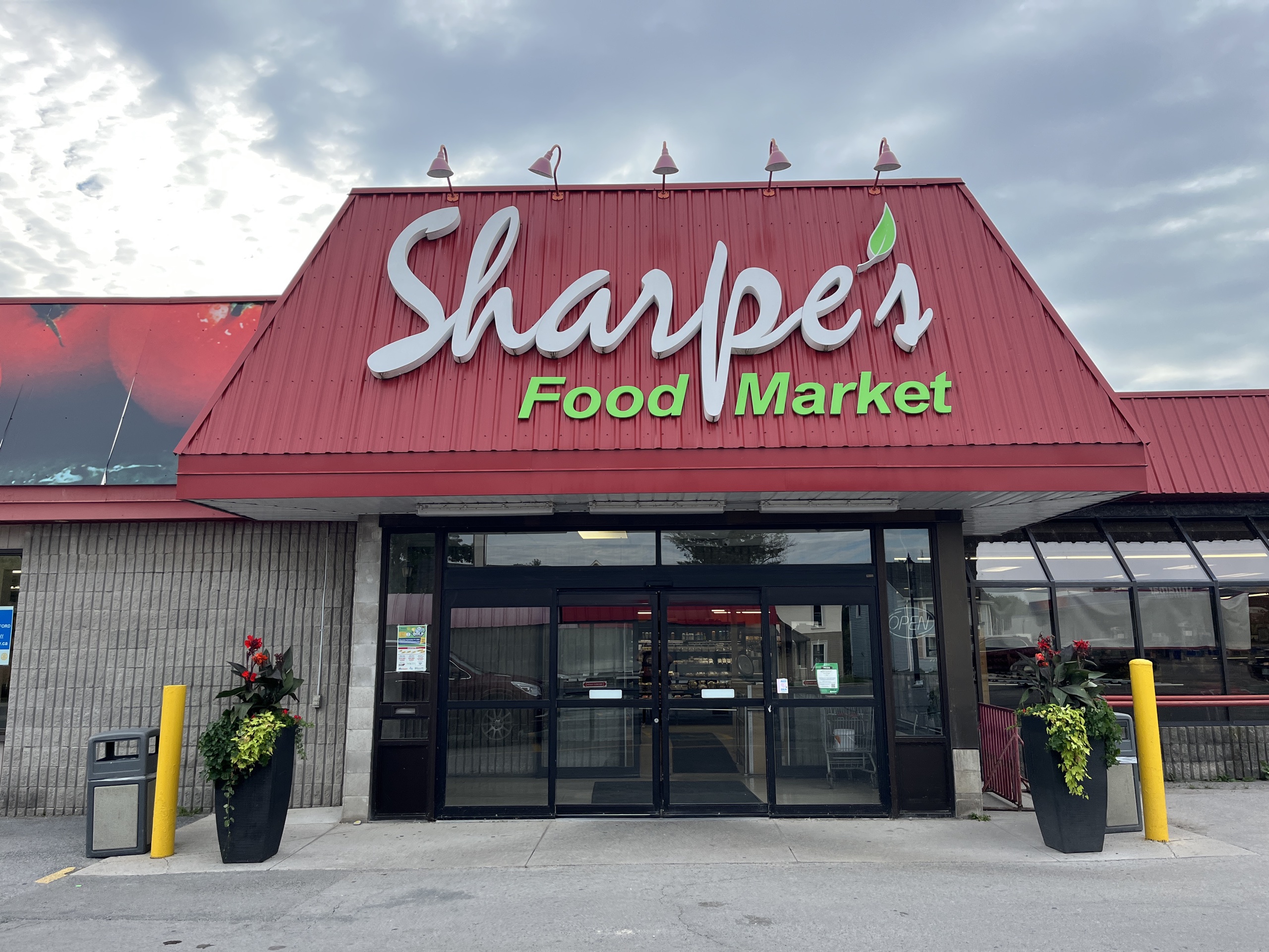 Photo of Sharpe's Food Market store front.