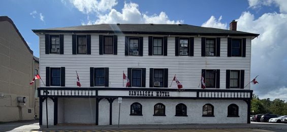 Wide white building with black trim and finishings.