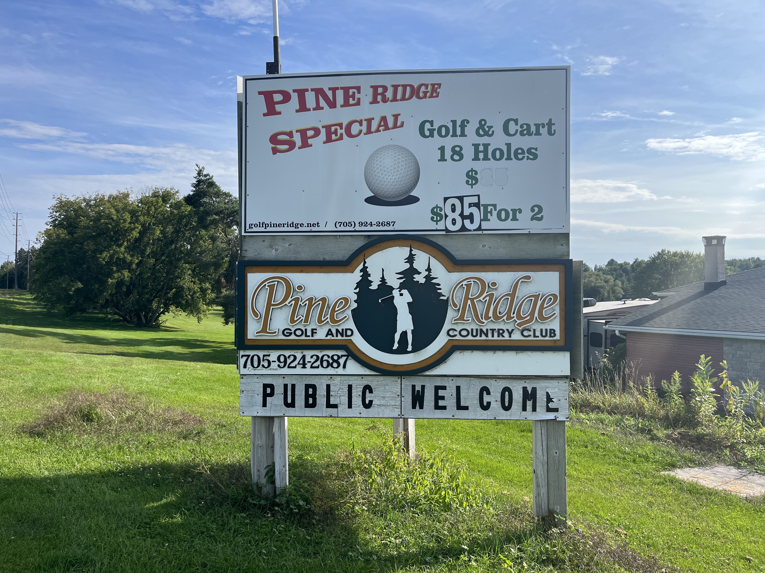 Photo of Pine Ridge Golf Club sign. Sign reads "Pine Ridge Golf and Country Club. 705-924-2687."