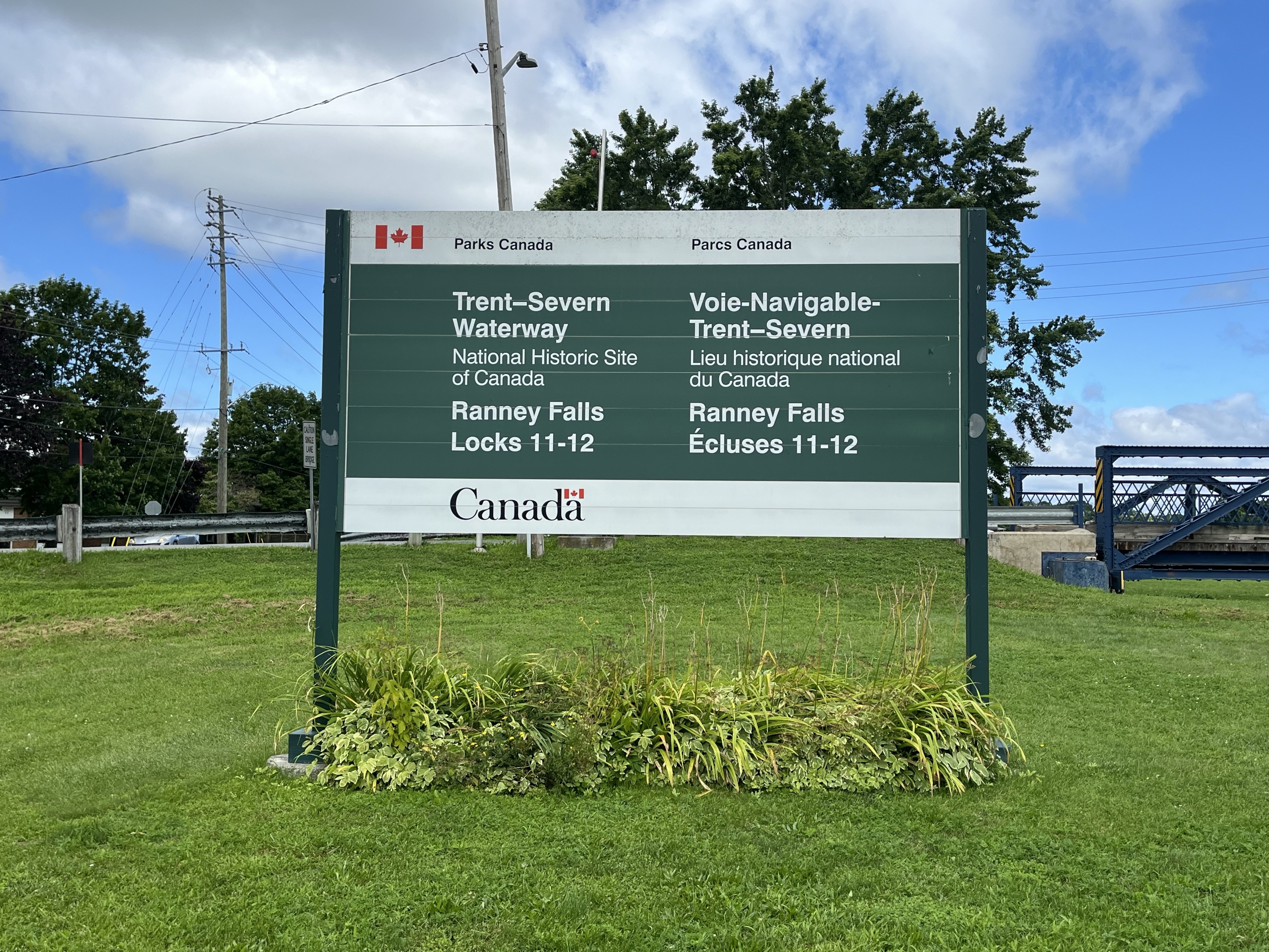Photo of Trent-Severn Waterway sign. Sign reads "Trent-Severn Waterway. National Historic Site of Canada. Ranney Falls Locks 11-12."