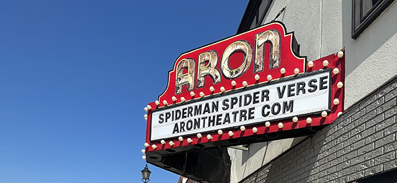 Red, white and yellow theatre style light up sign.