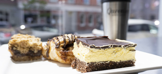 Nanaimo bar and 2 other baked goods on a table.