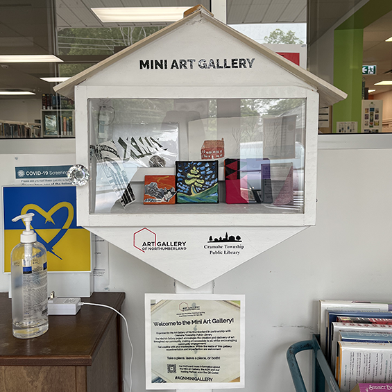 White hexagon with a window showing multiple small art creations.