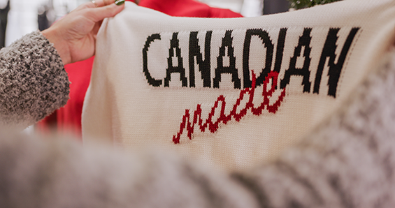 A white sweater with black and red writing