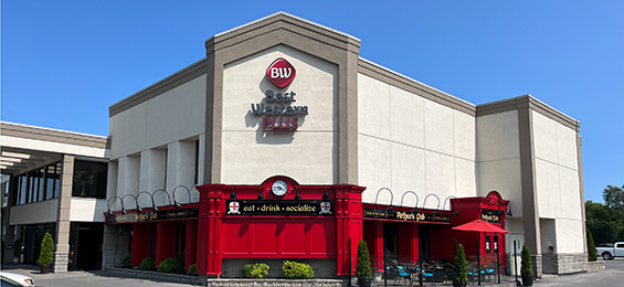 Large white building with red bottom section.