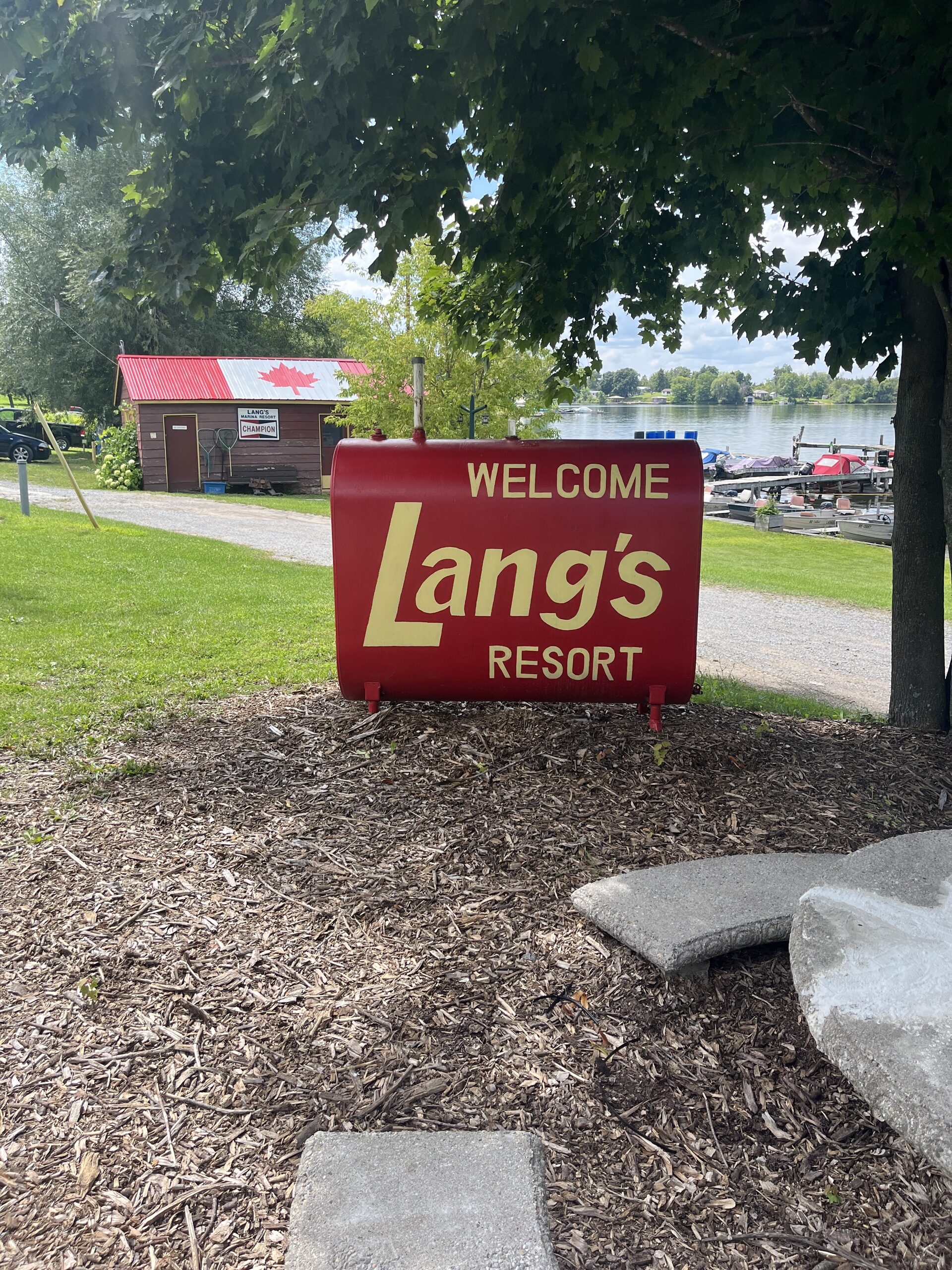 Photo of Lang's Resort sign. The sign reads "Welcome Lang's Resort."