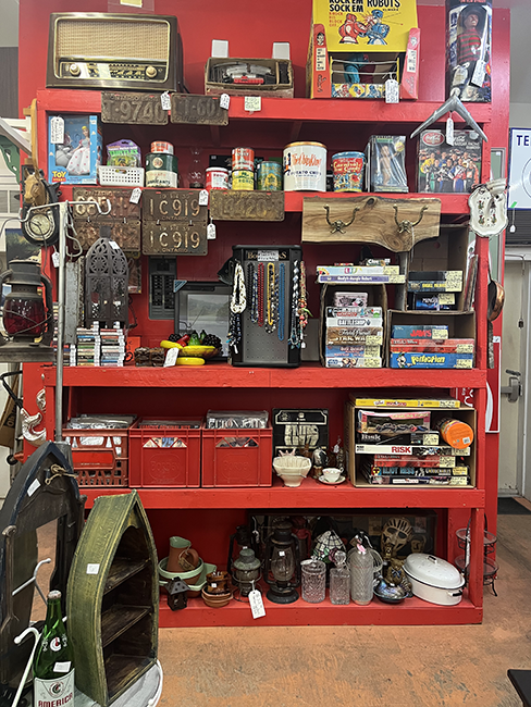 Red shelving with various items