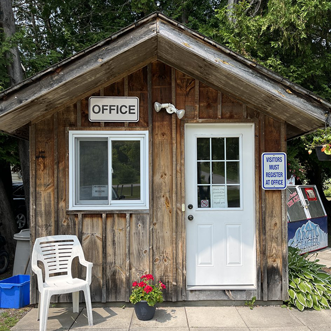 Small wooden building with a white door