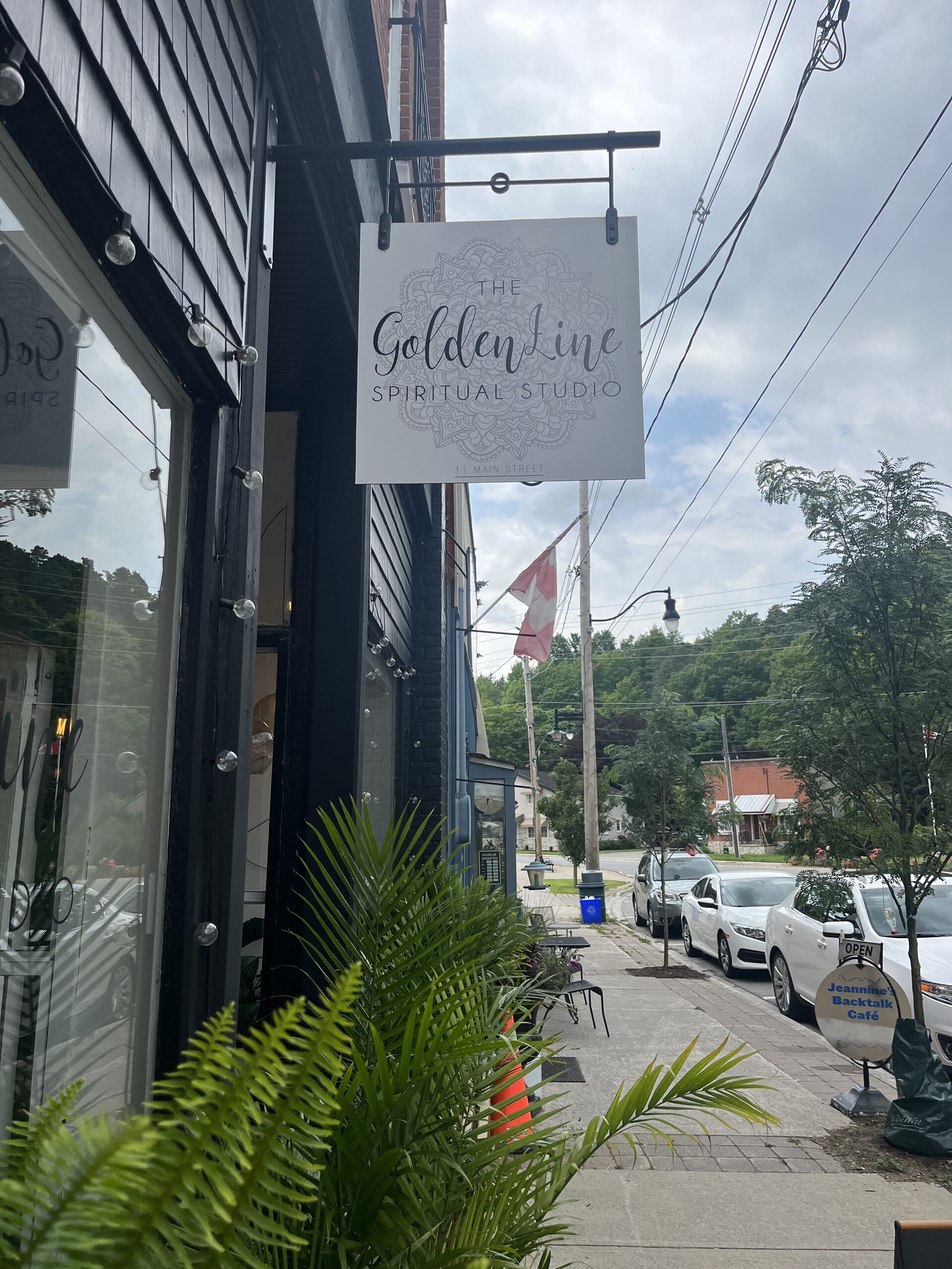 Photo of The GoldenLine sign. Sign reads "The GoldenLine Spiritual Studio."