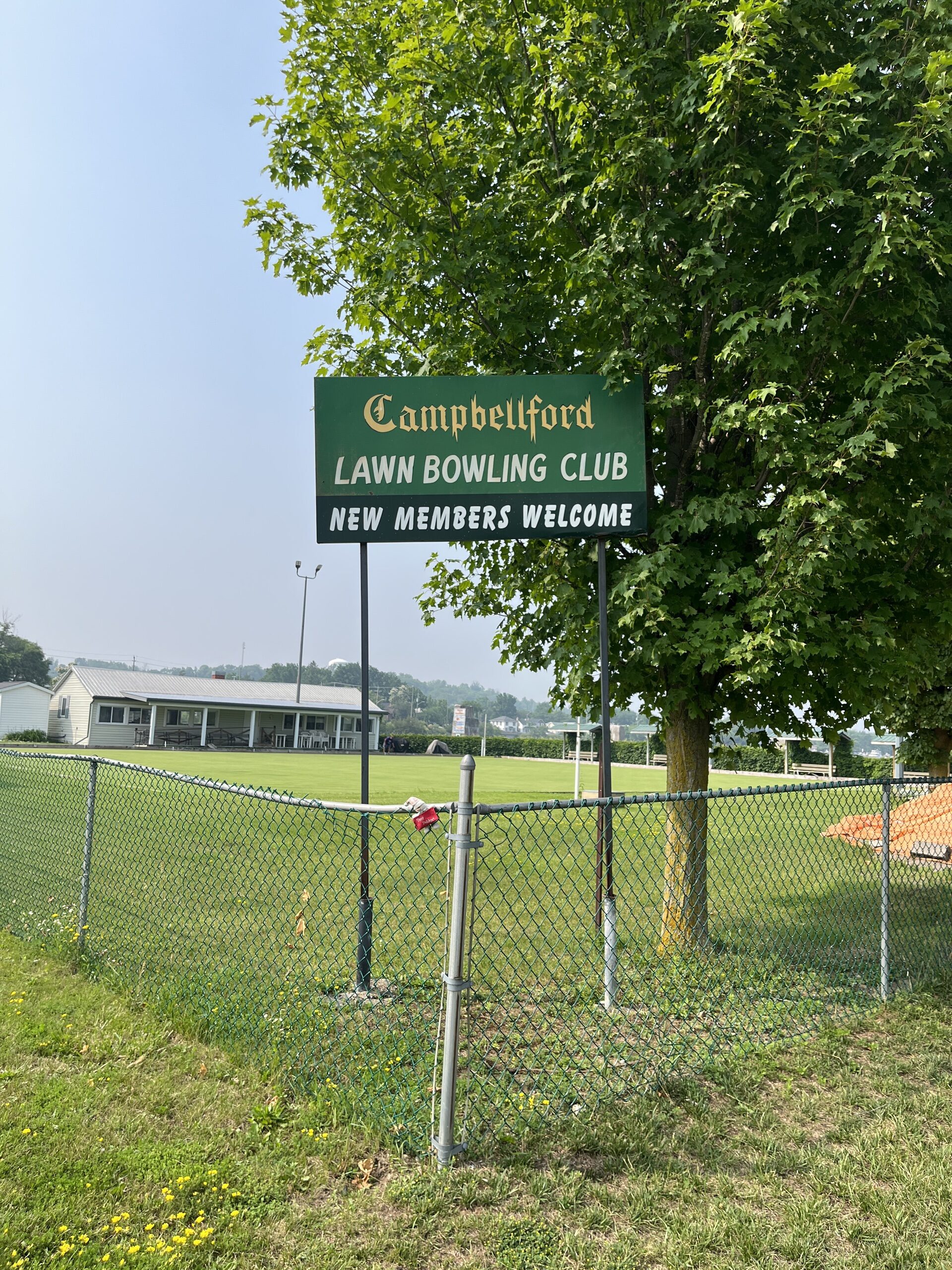 Photo of Campbellford Lawn Bowling sign. Sign reads "Campbellford Lawn Bowling Club. New members welcome."