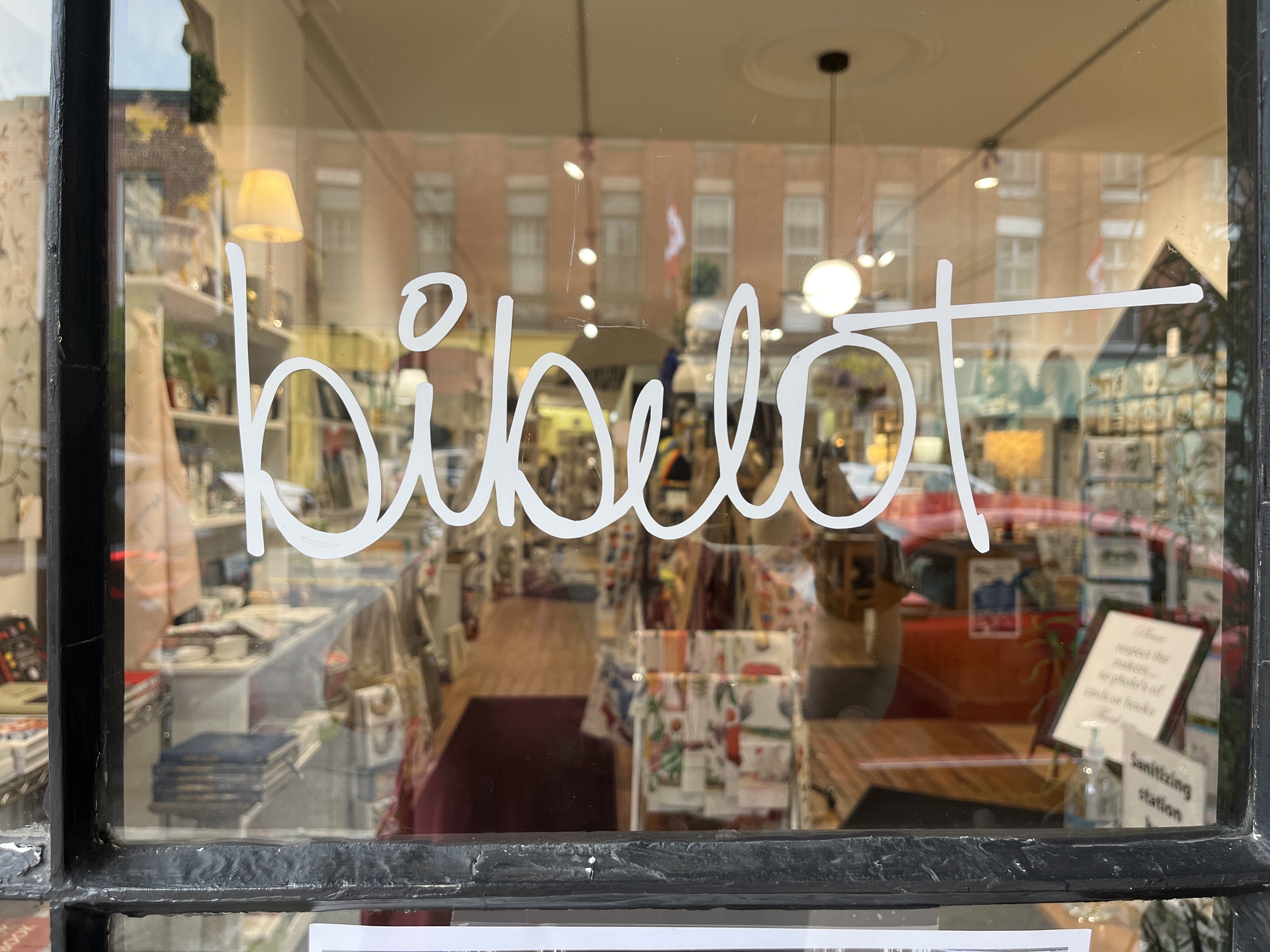 Photo of Bibelot window. Window features writing reading "Bibelot."