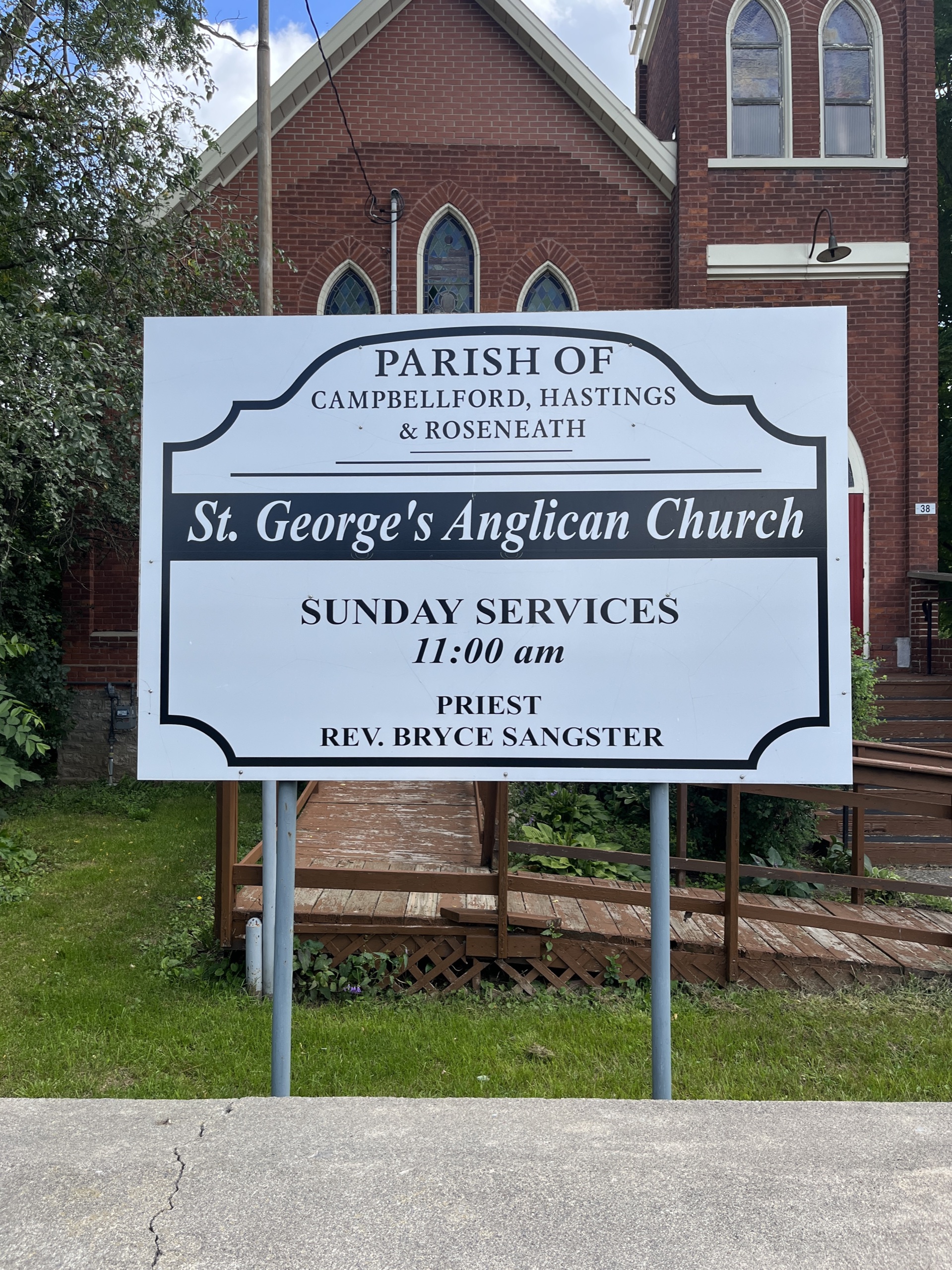 Photo of St George's Anglican Church sign. Sign reads "Parish of Campbellford, Hastings & Roseneath. St. George's Anglican Church. Sunday Services 11am."