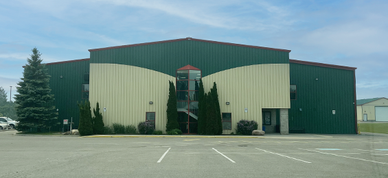 Large green and tan building