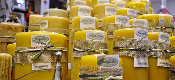 Yellow beeswax candles with burlap wrapped around the center