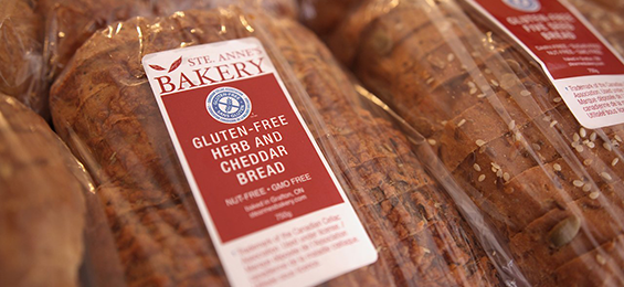 Loaves of bread with red and white labels.