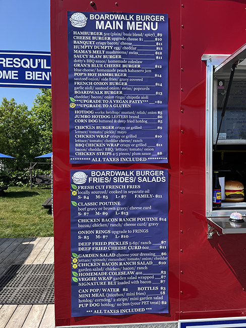 Blue food truck menu on a red food truck