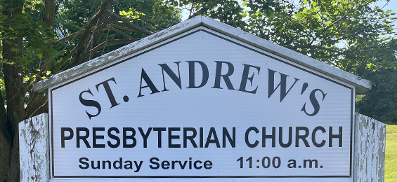 White sign with black writing