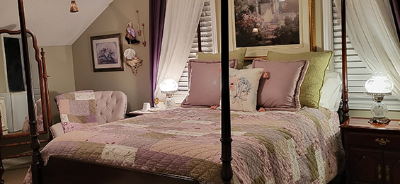 Interior view of room in bed and breakfast with four poster bed
