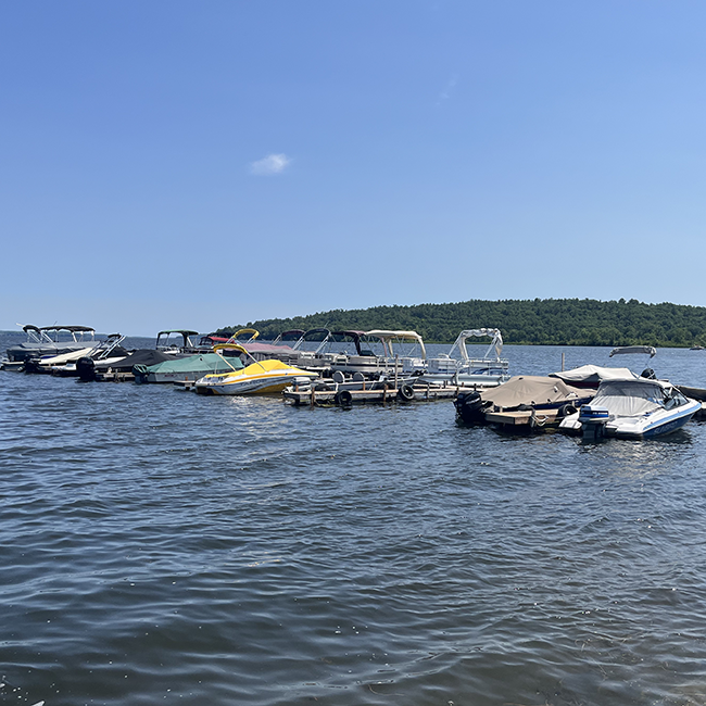 Many boats docked at a marina.