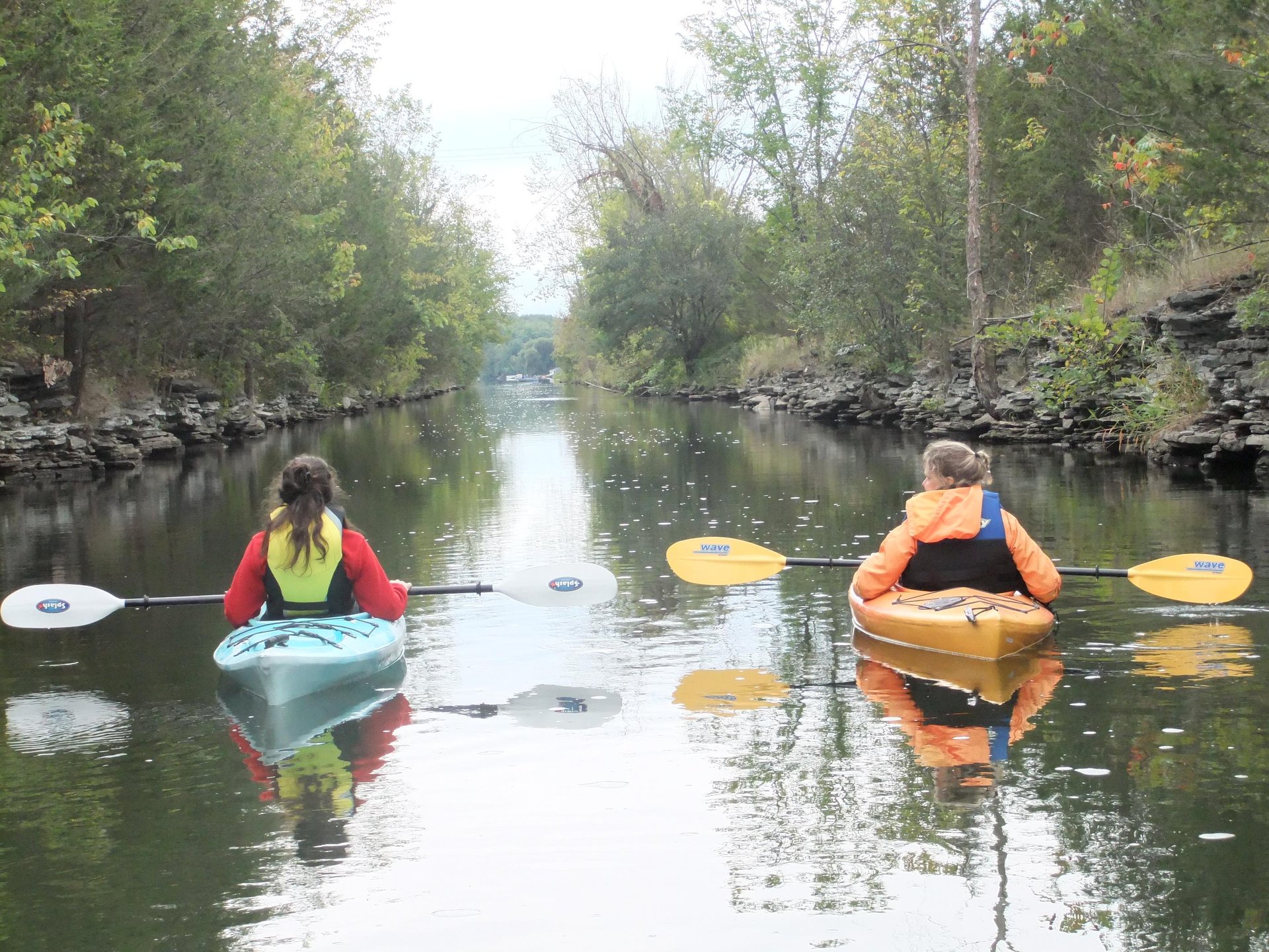 2 people kayaking on a river