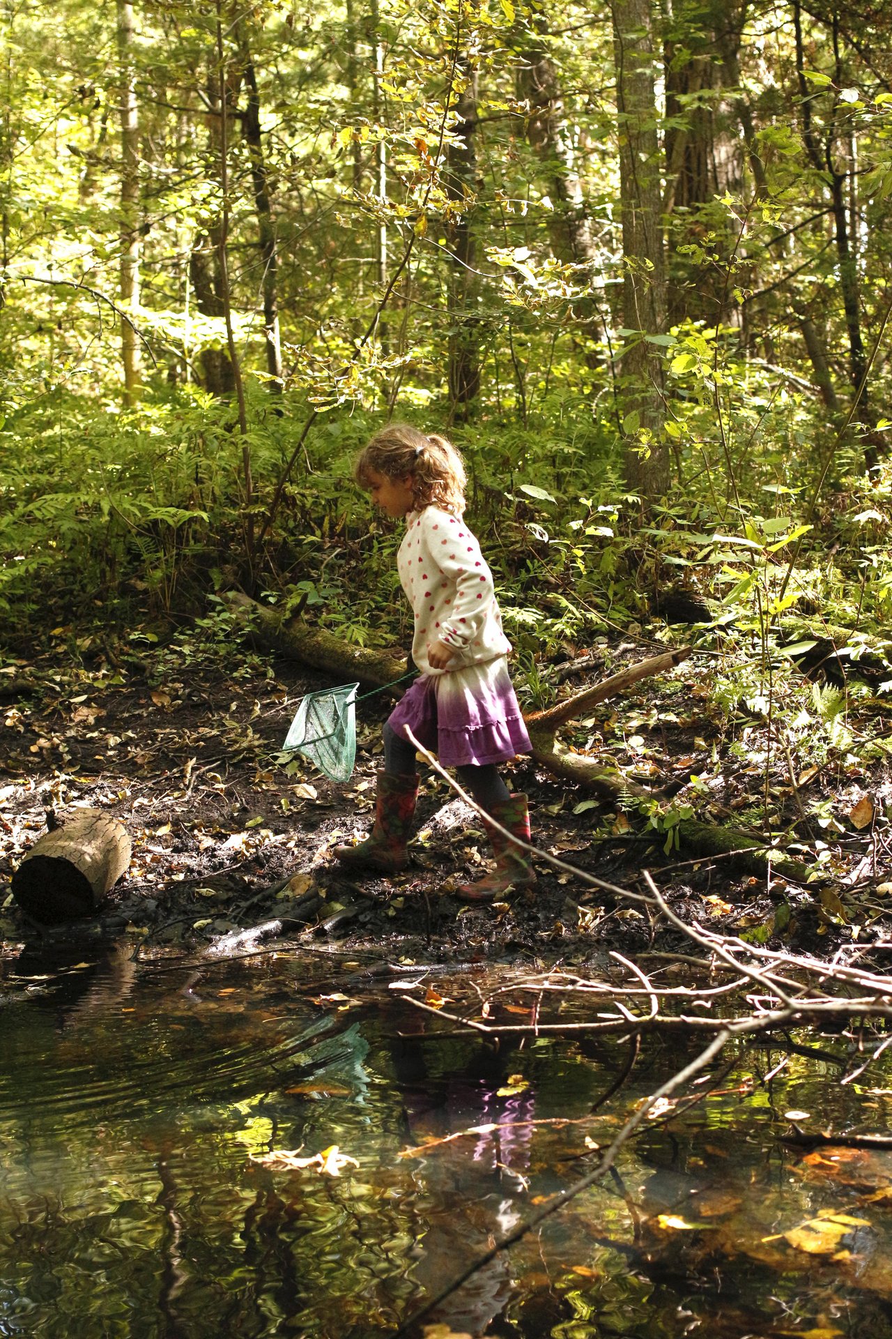 girl walking near a pond at Laurie Lawson outdoor education centre