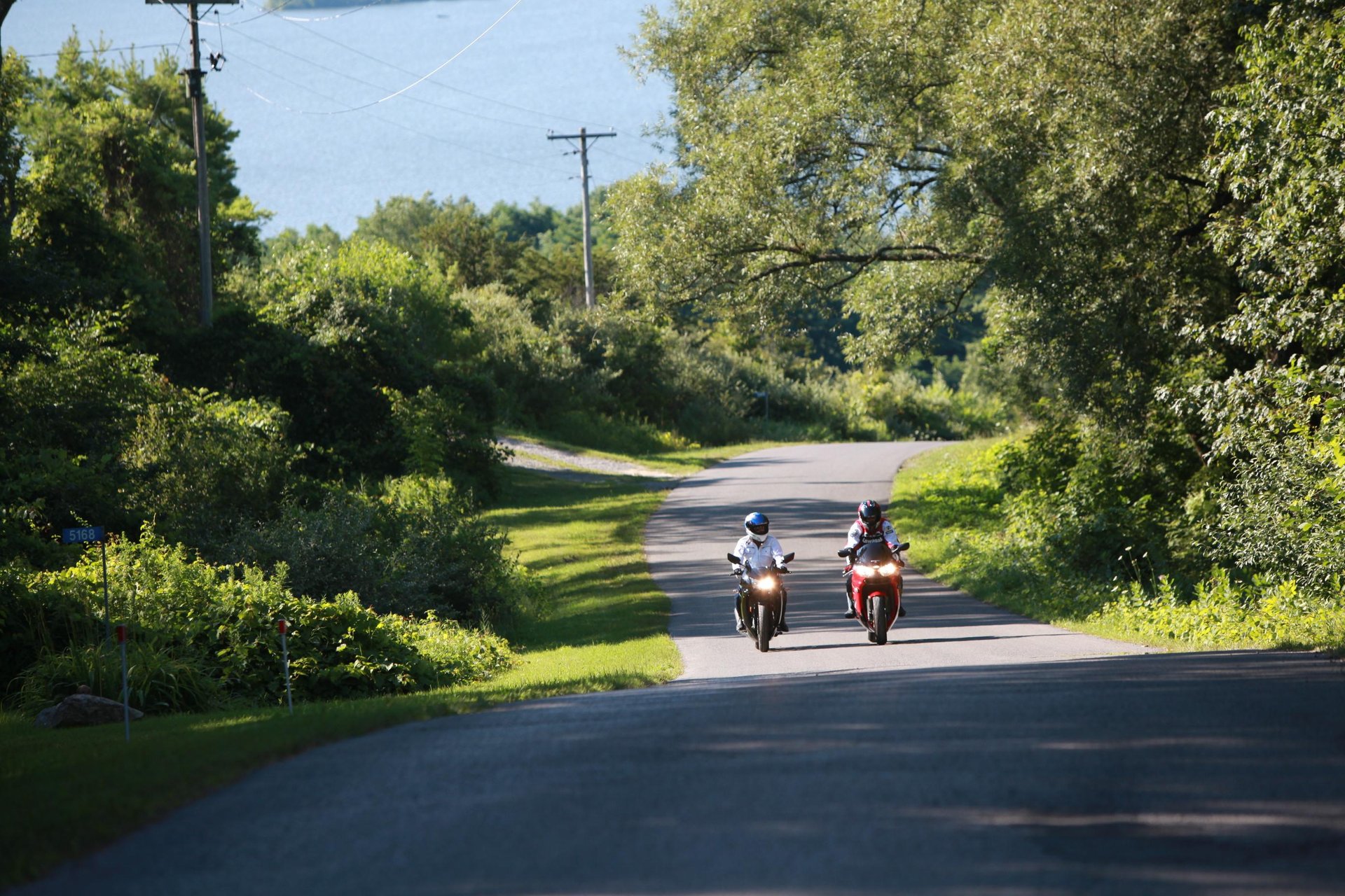 two motorcyclists on a country road