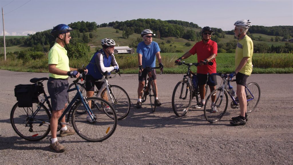 Group of cyclists standing with their bikes