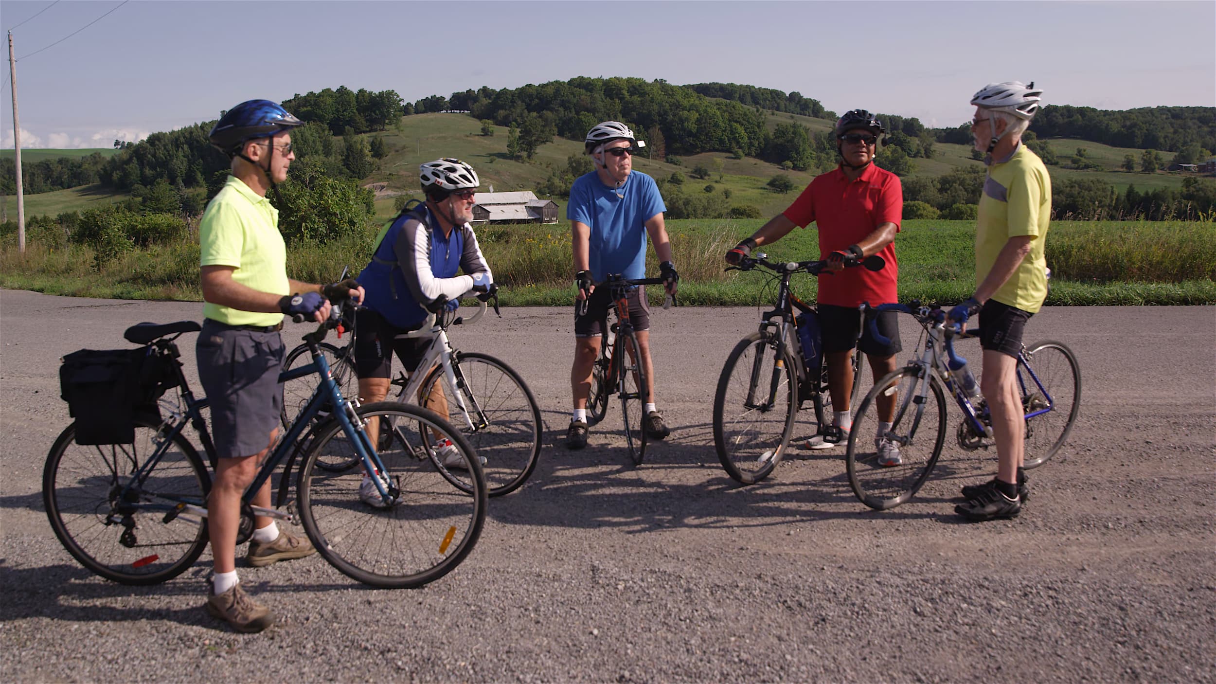 Group of cyclists standing with their bikes