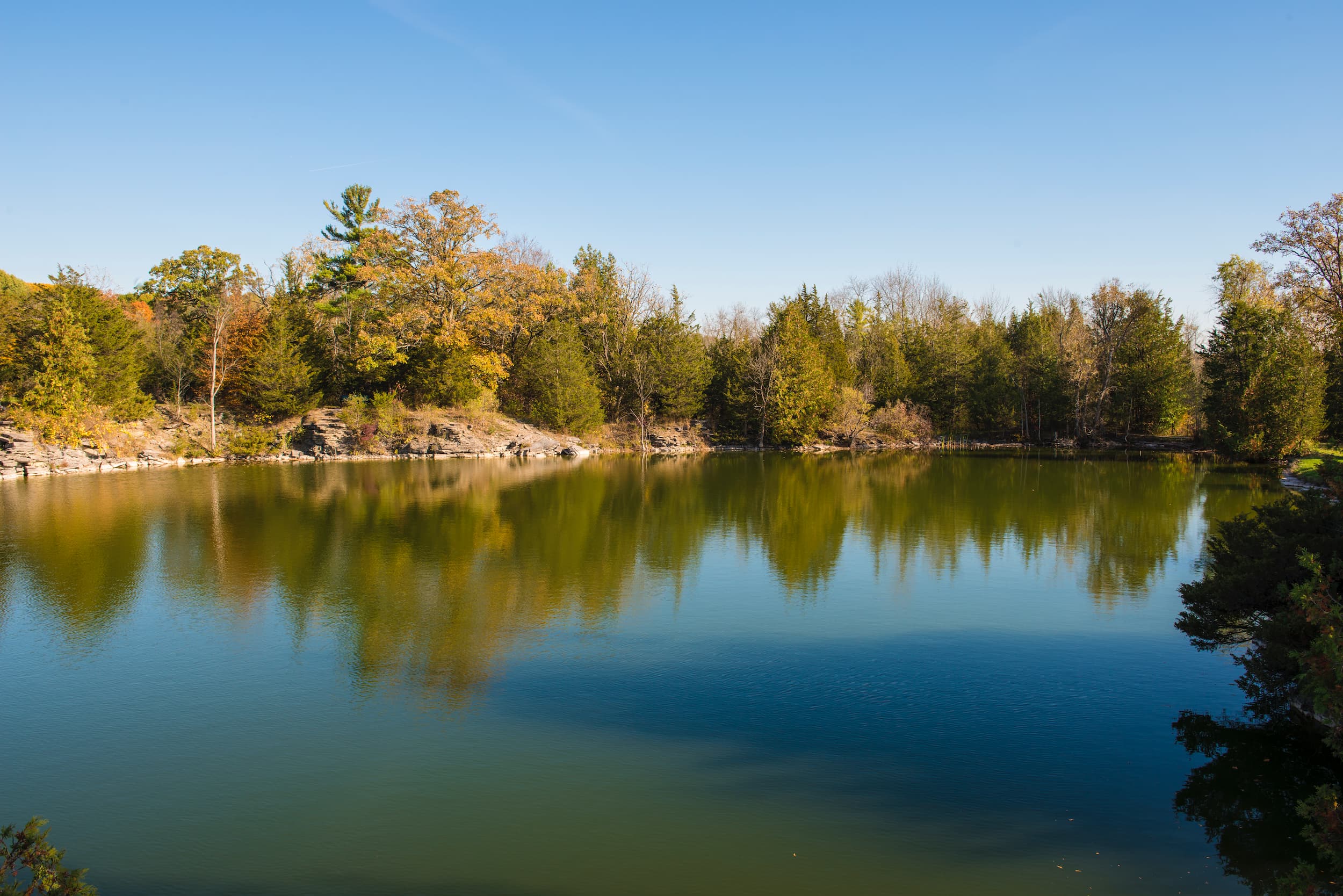 View across a small body of water in fall at the Seymour Conservation Area.