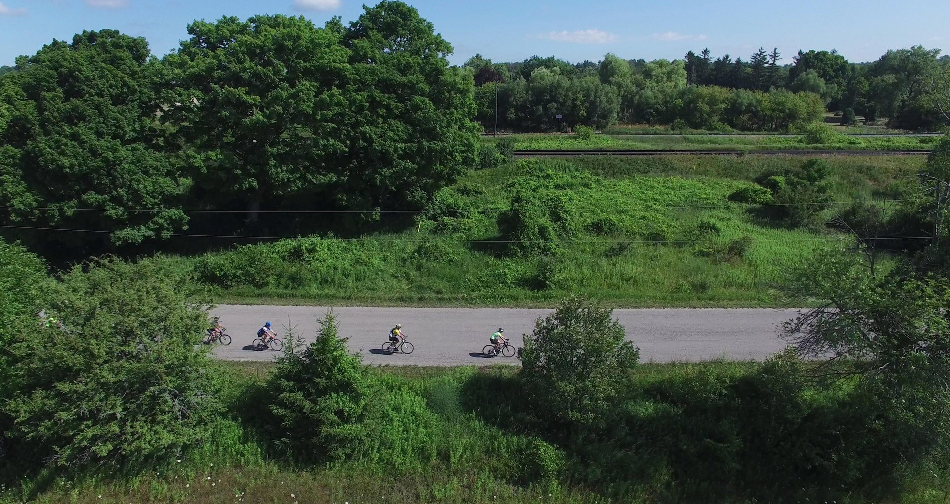 Drone view of cyclists riding on a country road